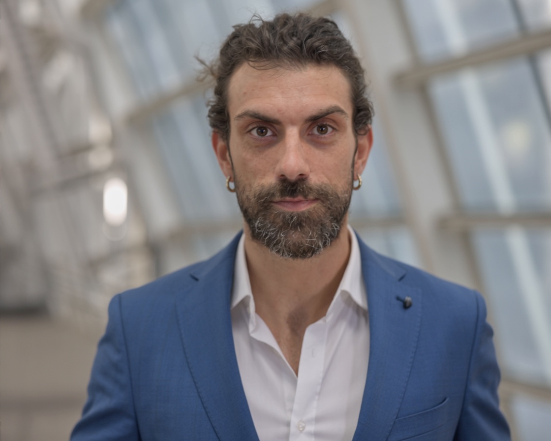 Paolo Barranca wearing a blue suit in London